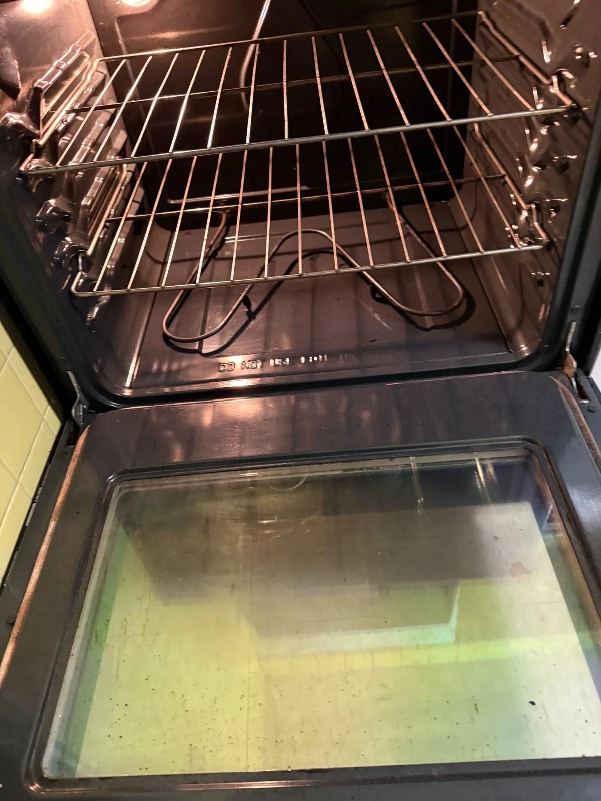 After: Before and after of a rental oven interior during a move-out clean by Maid With Precision, from baked-on grease on the oven floor and door glass to a clean interior and clear glass